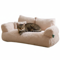 Tabby cat on plush sofa
