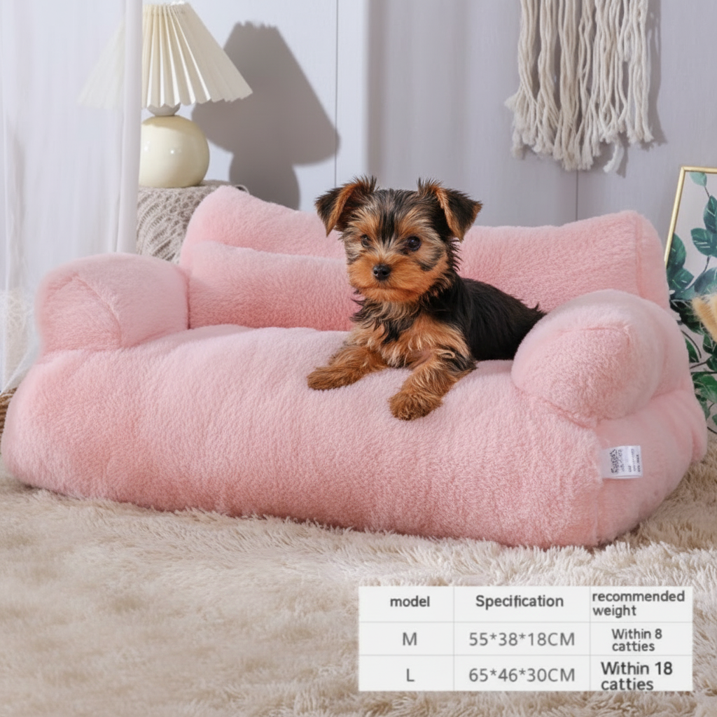 Yorkie on pink plush sofa